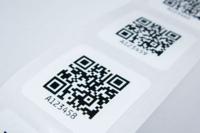 close image of 29mm square nfc tag with a qr code print