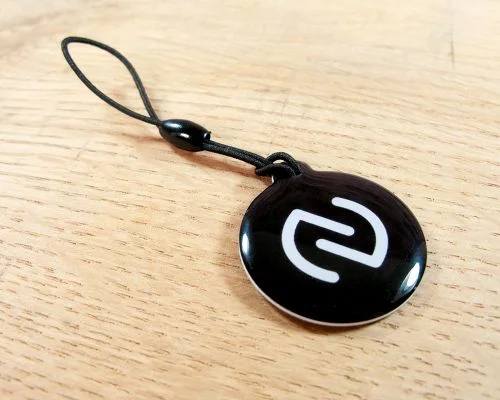 Close up image of an NFC NFC Dog Tag