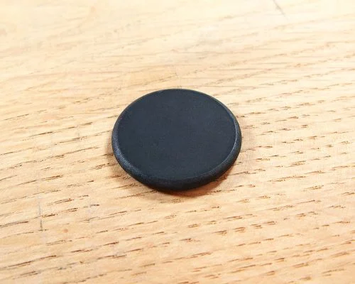 Close up image of an NFC 26mm PPS Disc Tag NTAG424