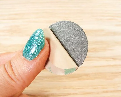 Detail of an NFC Custom Print On-Metal Bubble Disc Tags