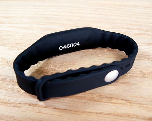 Close up image of an NFC Classic Slim Popclip NFC Wristband