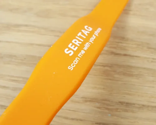 Close up image of an NFC Smooth Slim Popclip NFC Wristband