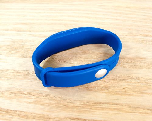 Close up image of an NFC Premium Slim Popclip NFC Wristband