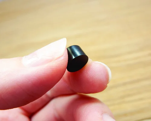 Close up image of an NFC 8mm On-Metal PPS Disc Tag
