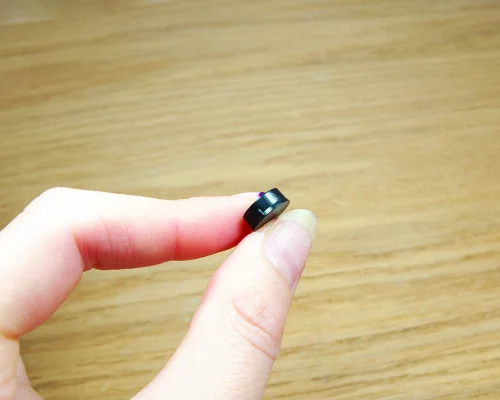 Close up image of an NFC 10.4mm On-Metal PPS Disc Tag