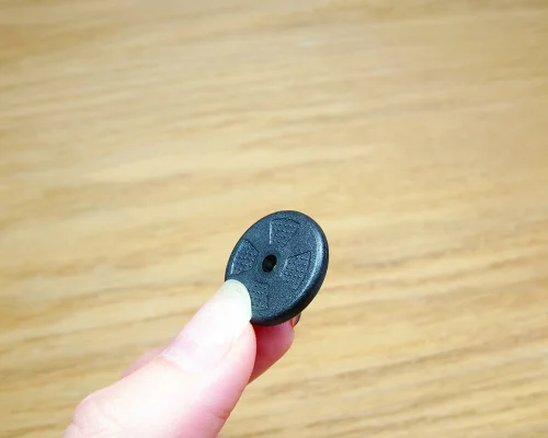 Close up image of an NFC 20mm On-Metal PPS Disc Tag