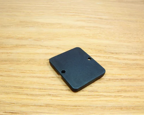 Close up image of an NFC 37x42mm On-Metal PPS Disc Tag