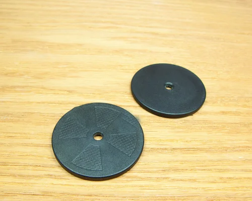 Close up image of an NFC 50mm On-Metal PPS Disc Tag