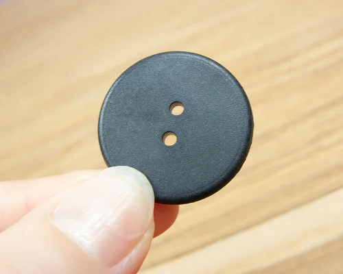 Side view of the NFC 25.5mm Button Laundry Tag NTAG213