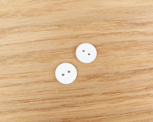 Detail of an NFC Custom Print 15mm Button Laundry Tag