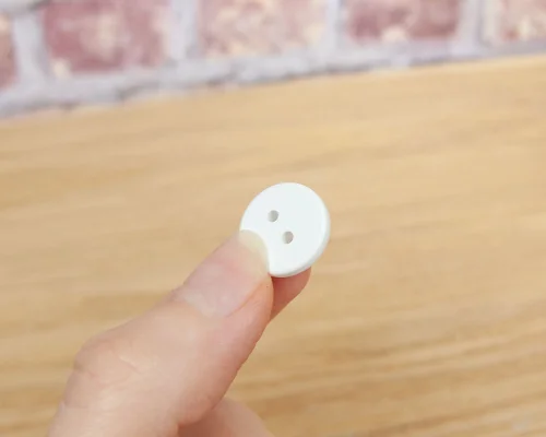Side view of the NFC Custom Print 15mm Button Laundry Tag